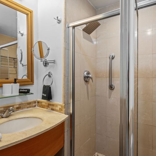 Refresh and rejuvenate. Our sparkling clean bathroom features a spacious walk-in shower with a rain showerhead, perfect for washing off the day's adventures.