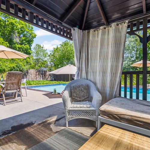 Cozy outdoor seating area to relax after a refreshing pool swim.