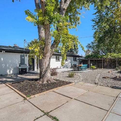 Enjoy the expansive back of the house, showcasing a large patio that’s perfect for entertaining or unwinding.