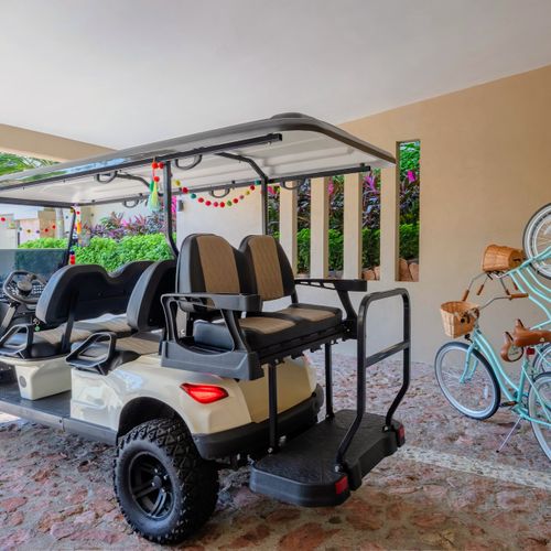 Included Golf Cart and Bicycles in Reserved Covered Parking Nearest to Building