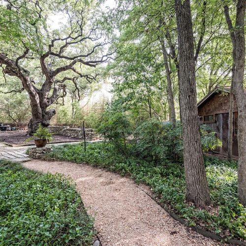 Over one acre of granite trails, bamboo and trees in a park like setting