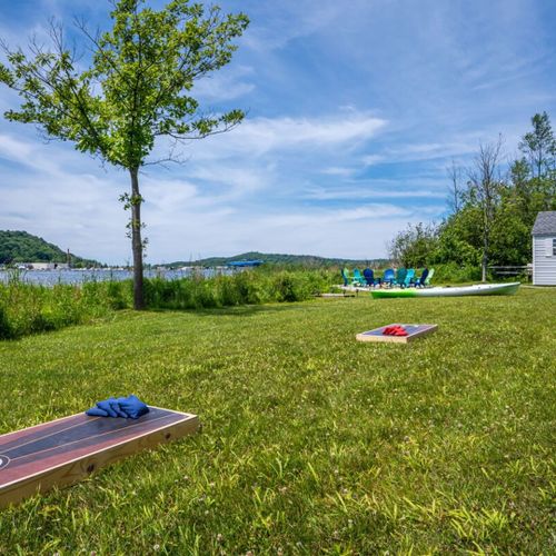 Exterior:  the home also has its own corn hole game for fun family times!