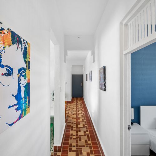 Apartment hallway with Lennon