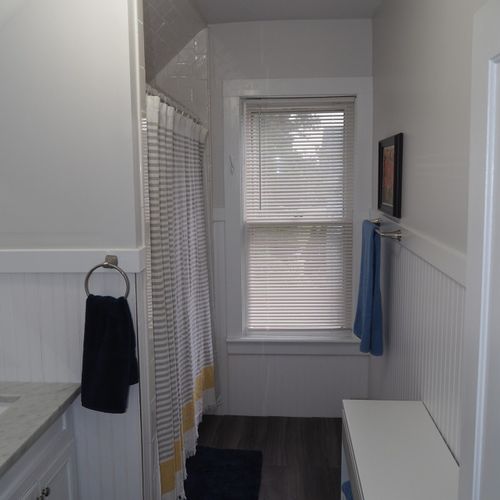 Bathroom #2 (upstairs):  there is a full bathroom upstairs with a combination bathtub / shower, toilet, vanity, sink, and mirror.
