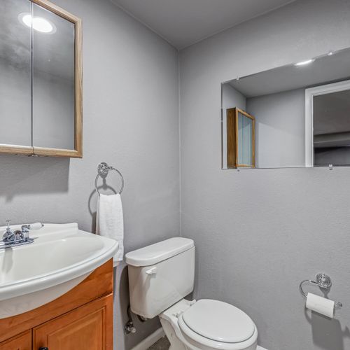 A convenient half bathroom is located in the basement.