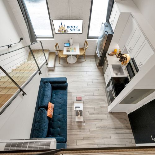 Sunshine pours through grand-paneled windows, filling the living area w/ warmth.