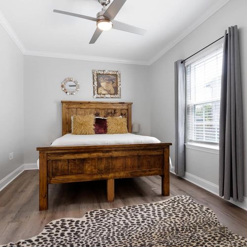 Master bedroom w/ queen bed & a private ensuite bathroom.