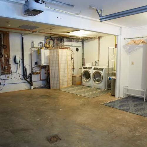Enter into the laundry room with plenty of storage for all shoes and coats