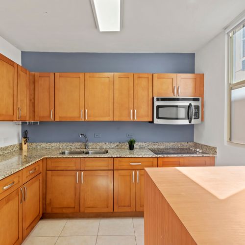 A charming and functional kitchen. The warm wooden cabinets and spacious counters provide everything you need to prepare meals with ease.