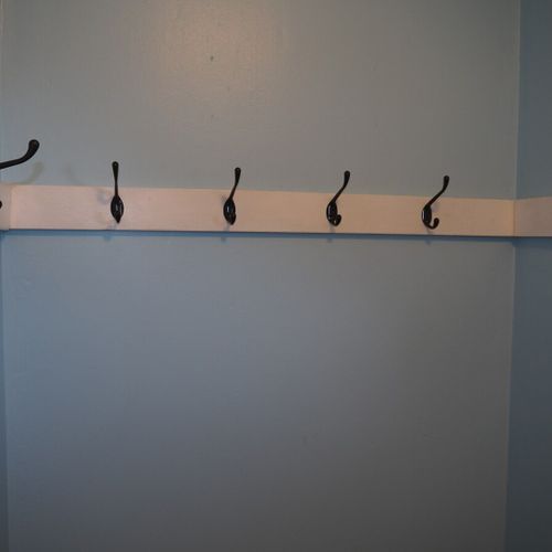 Foyer:  front foyer includes a mirror, open closet, and lots of hooks for hanging clothes.