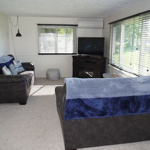 Living room:  the home has a comfy living room with new furniture and a nice view of manistee lake.