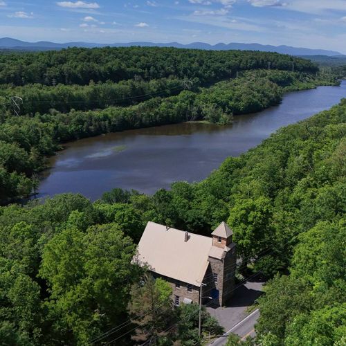 A bird's eye view of The Rifton. The Wallkill River meanders in the background, with the Catskill Mountains on the horizon.