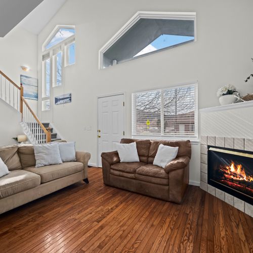 Comfortable lounge area with fireplace and plenty of natural light