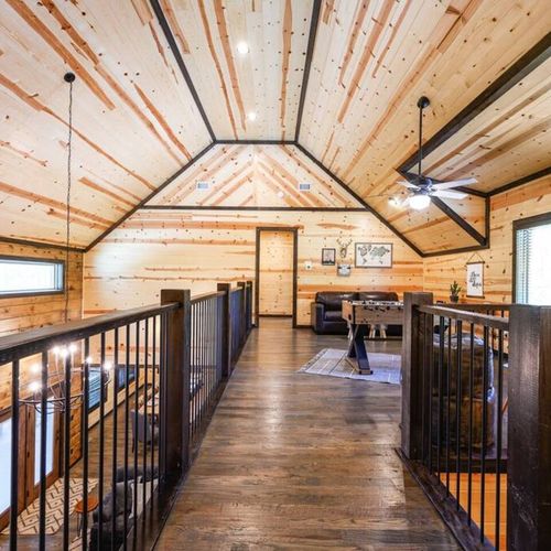 The upstairs loft with a sleeper couch and foosball.