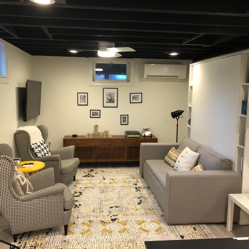 Cozy downstairs living area with Queen sized Murphy bed and smart TV.