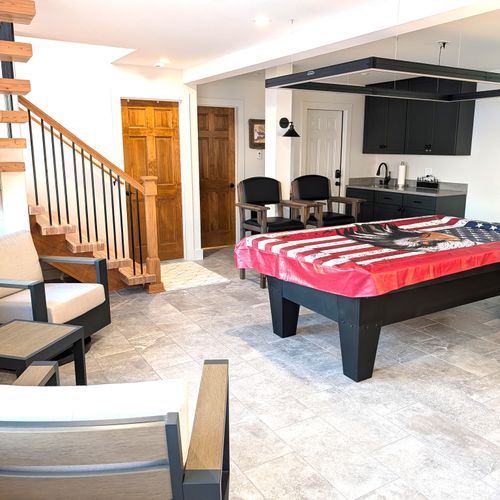 GAME ROOM (LOWER LEVEL):  The home has an incredible game room on the lower level with a championship pool table and large screen television.