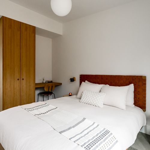 Clean and serene  bedroom with soft lighting for ultimate relaxation