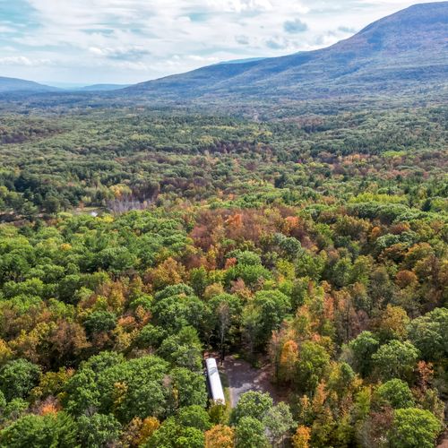 Aerial view with Catskill Mountains in the distance.