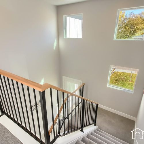This home boasts lofty windows and extended ceilings, allowing daylight to flow in effortlessly.