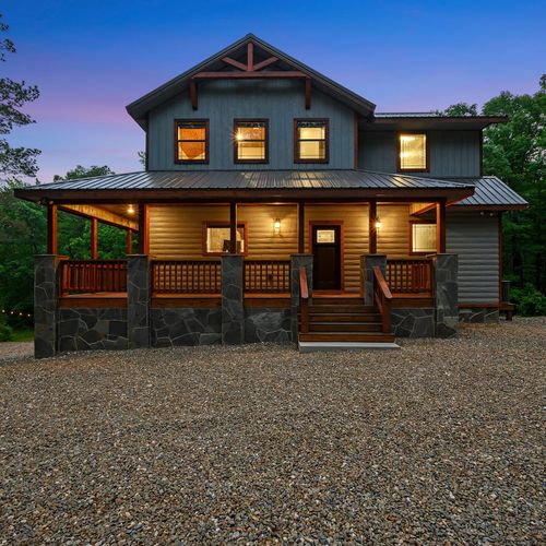 Redberry Retreat, a three-story sanctuary nestled amidst serene creek and woodland views.