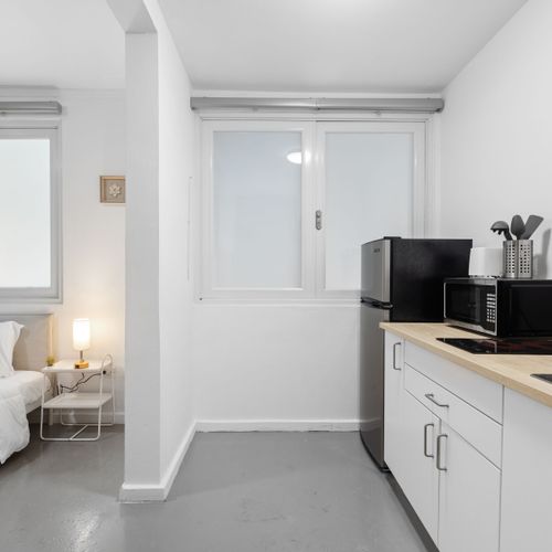 Culinary Convenience: Enjoy the ease of a fully-equipped, modern kitchenette, perfect for preparing your favorite meals or a quick morning coffee.