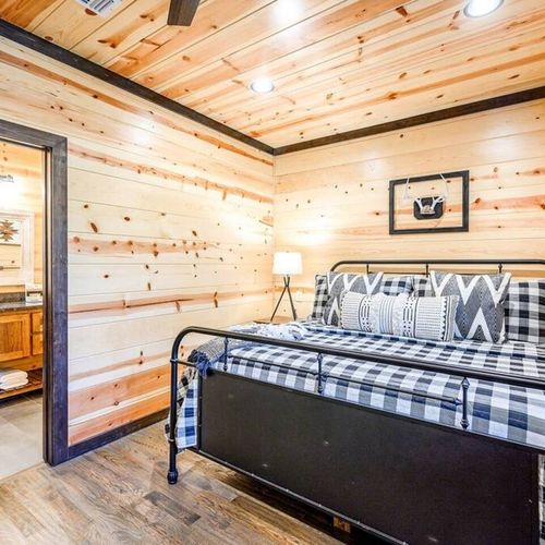 Upstairs King Bedroom 4 with a private bath and a twin daybed with a trundle.
