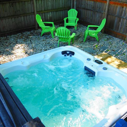 Exterior:  the hot tub and backyard bonfire ring.
