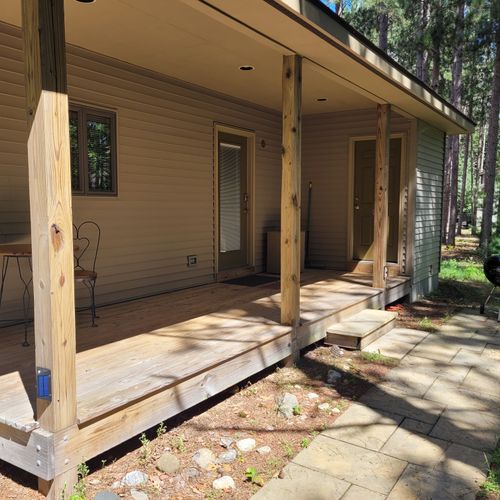 EXTERIOR:  Another view of the porch, including the charcoal grill.
