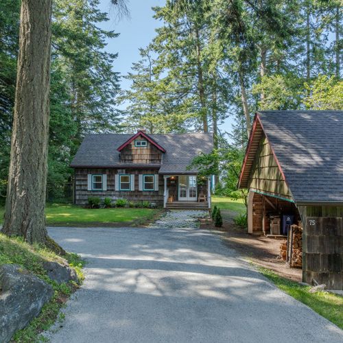 The carport was built for people, not cars.  It holds firewood, and is a great place to store your bikes, kayak and paddleboards that you bring.