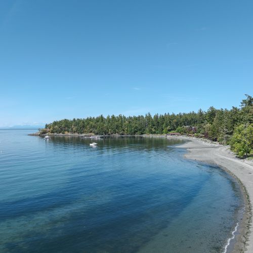 View of West Beach Resort and Point Kimple.  The Cascadian Range awaits beyond the Point.