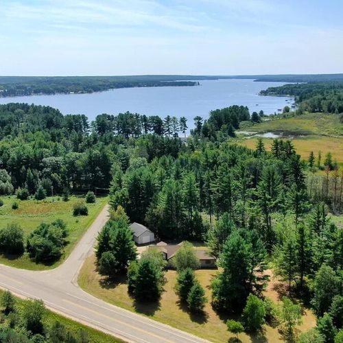 Overall:  a great aerial photo with the cabin in the foreground and otsego lake in the background.