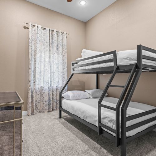 Twin over full bunks in roomy setup.