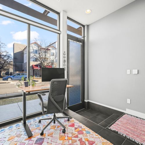 Light filled workspace with large windows, fast wifi, ergonomic chair and monitor