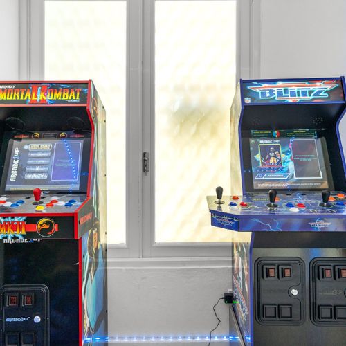 Challenge your friends to some retro fun with our collection of iconic arcade games set in a room with cool, mood-enhancing lighting.