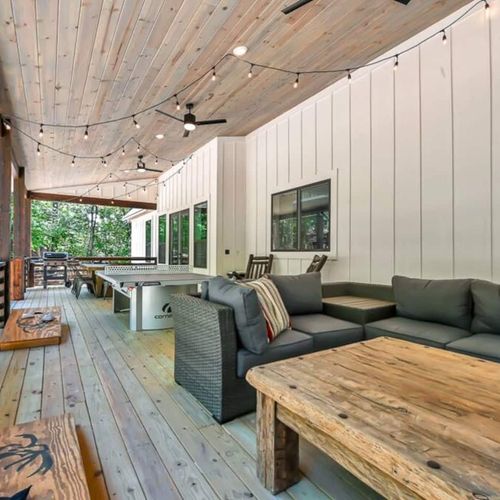 An oversized sectional and other entertainment can be found on the outdoor patio.