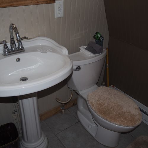 Bathroom:  small, but full bathroom, with entrance from the living room. Includes sink, mirror, toilet, and shower.