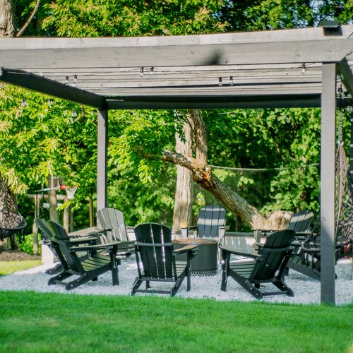 Whether in an Adirondack chair or hammock swing, you'll love sitting by the fire pit.