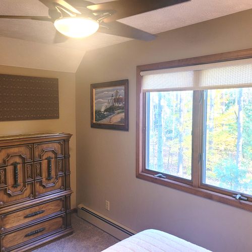 BEDROOM #3 (SECOND FLOOR):  Comfy bed with a queen-size bed, nightstand, ceiling fan, dresser, and closet.