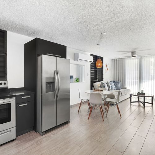 A bright kitchen with modern details and ample storage space.