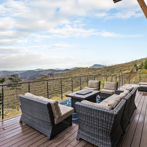 - bask in panoramic mountain and valley views from your elevated deck retreat
- outdoor lounge furniture offers comfort for every hour of the day
- whether storm watching or stargazing, the scenery is unforgettable