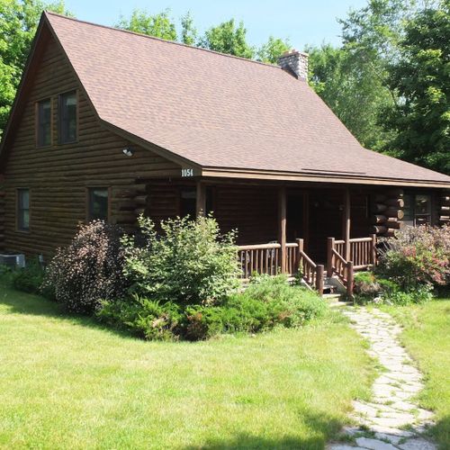 Exterior:  a nice overview of the front of the cabin in the summer