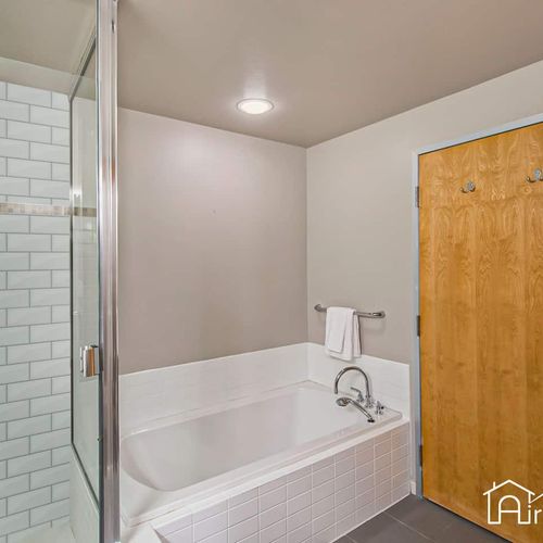 - unwind in a large soaking tub or refresh in the sleek walk in shower with subway tile
- spa like finishes and modern hardware give this bathroom a peaceful feel
- clean lines and warm tones create the perfect place to relax and reset