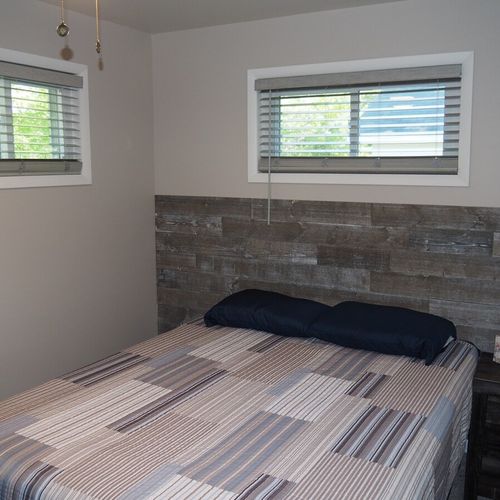 Bedroom #2:  also features a queen-size bed, ceiling fan, and closet.