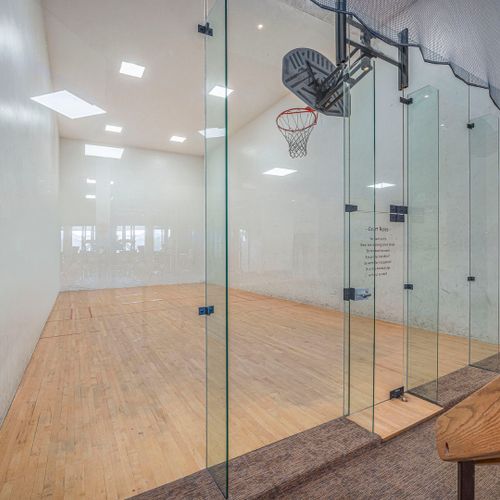 Enclosed basketball court for fun & practice.
