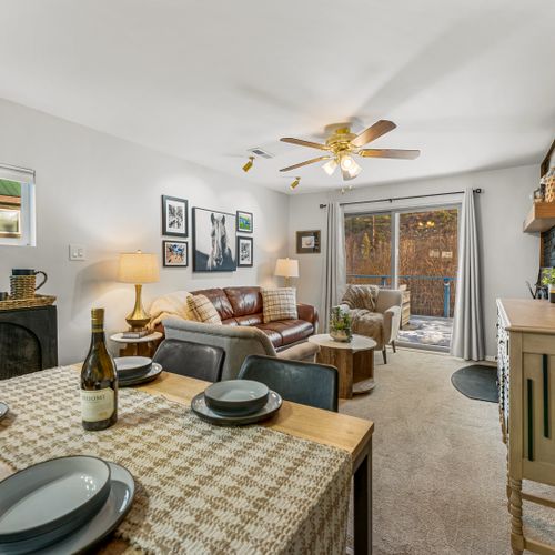 Share meals and stories in this warm dining space, surrounded by windows that bring the outdoors in!