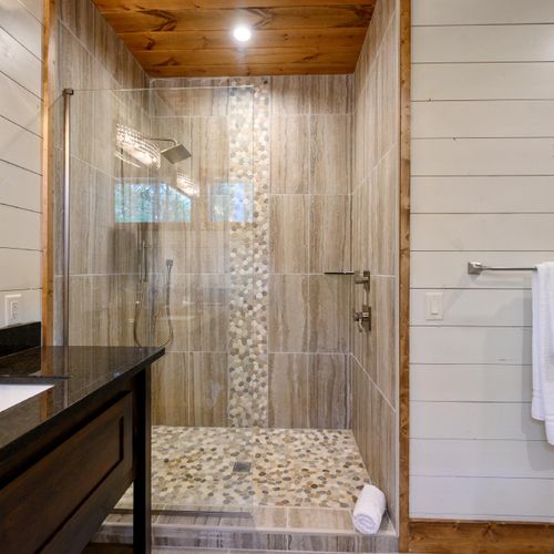 The private bathroom has a walk-in shower.