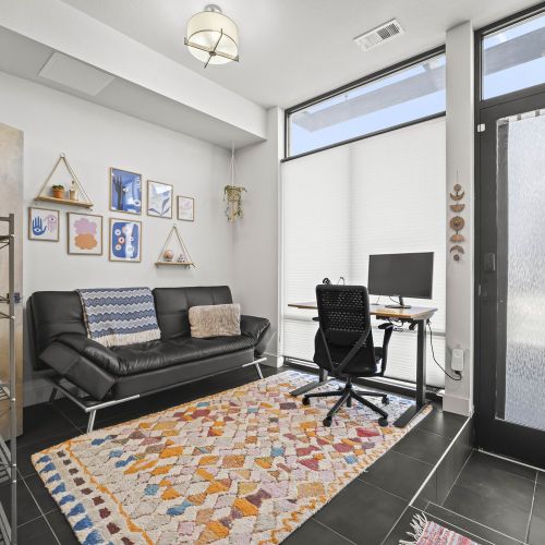 Futon bed by the office comfortably sleeps two, perfect for flexible stays