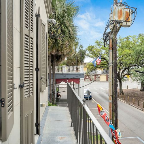 Enjoy a peaceful street view and a touch of New Orleans charm right from your private balcony.