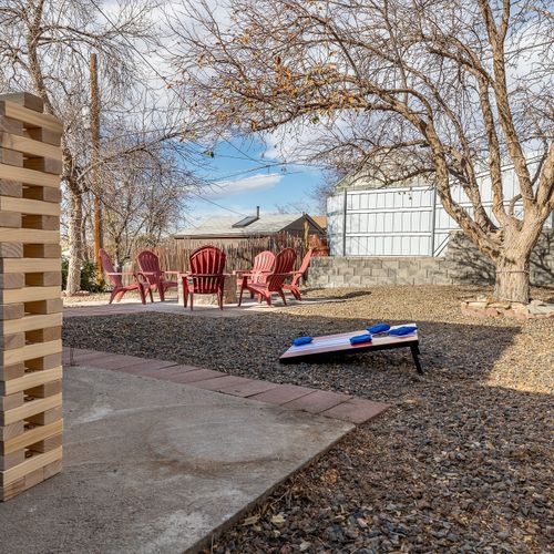 Take in the beautiful views from the large backyard with ample seating, hammock, and backyard games.