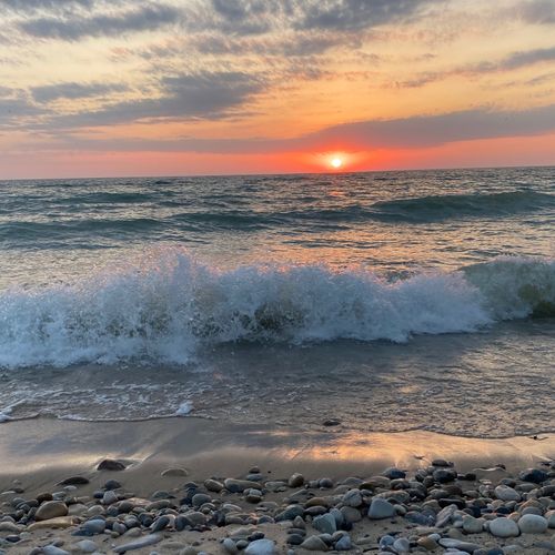 EXTERIOR:  Sunset on the private beach